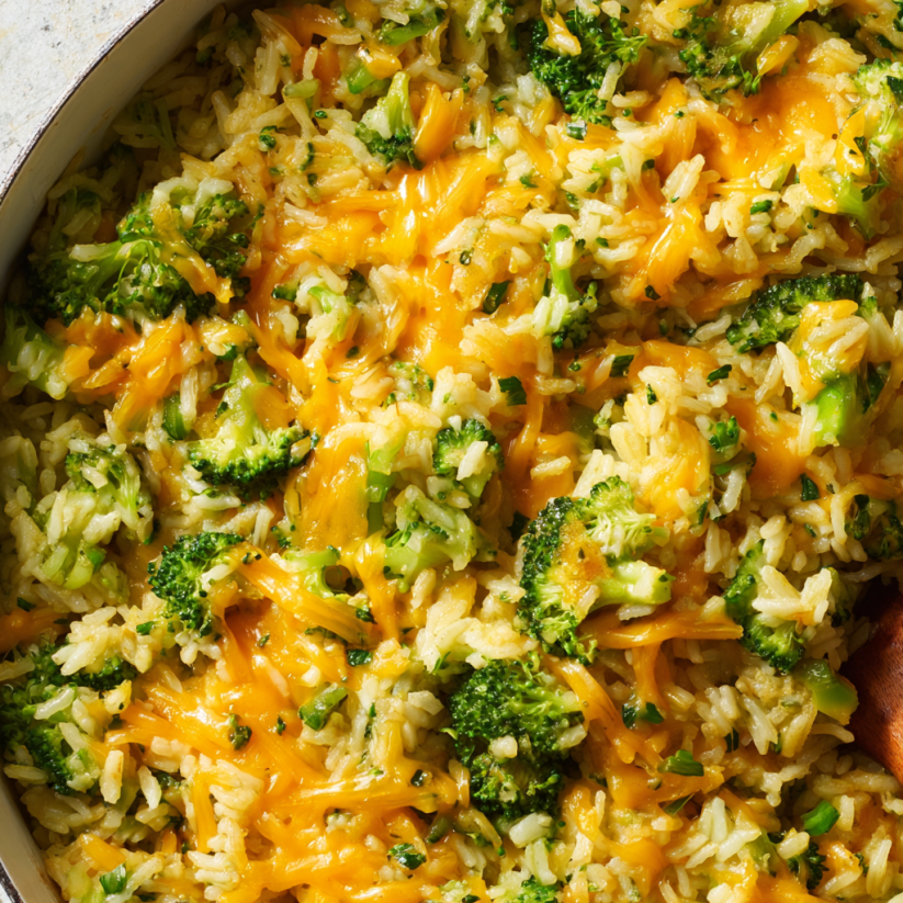 A dish of rice, broccoli, and cheese.