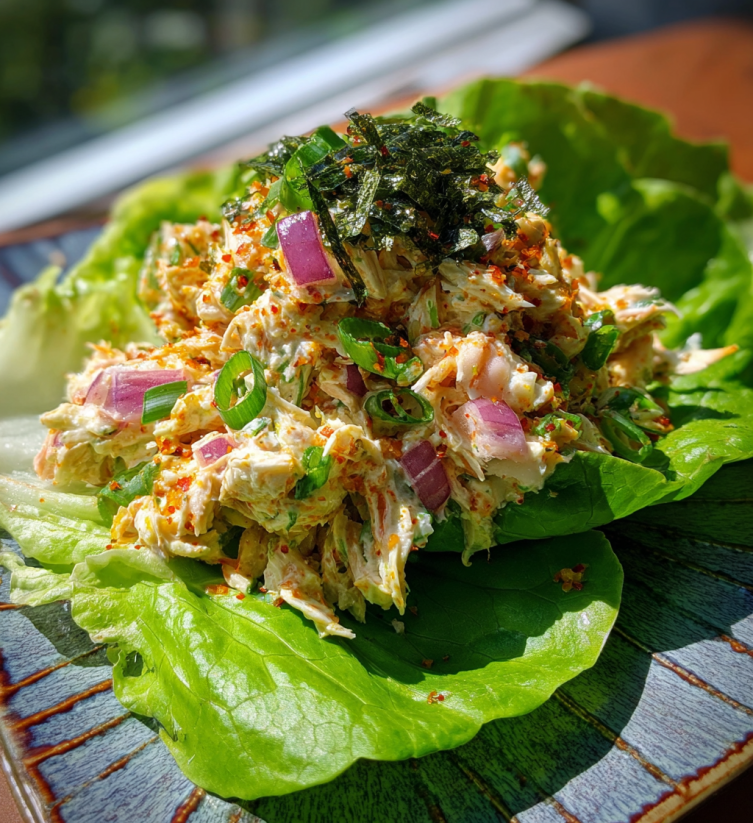 A plate of food with lettuce and onions.