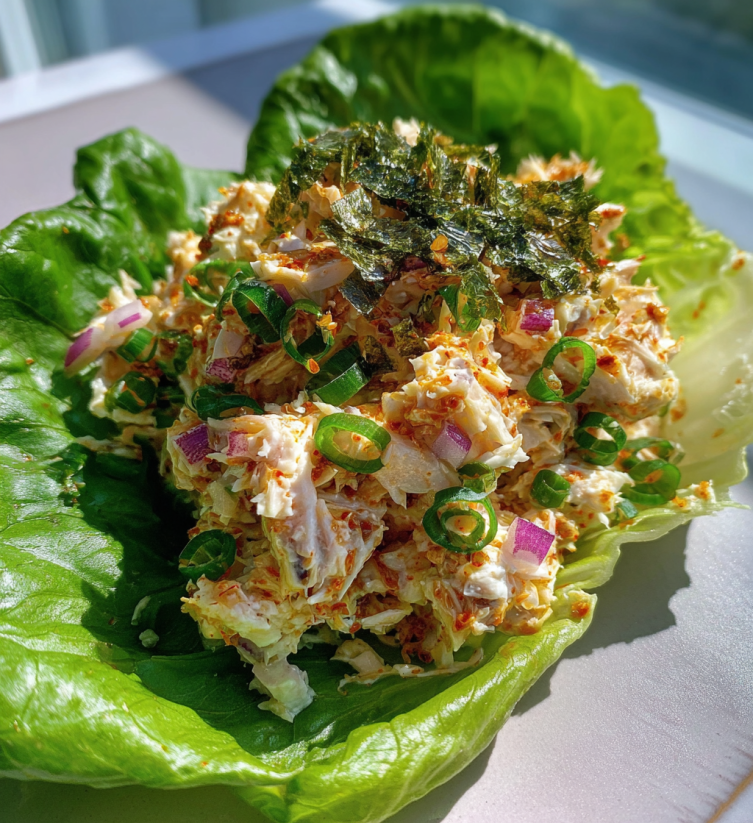 A salad with lettuce and crab meat.