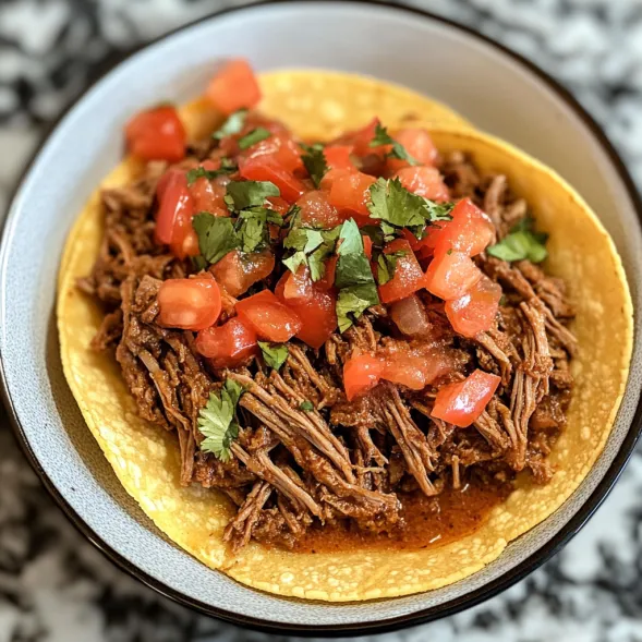 A plate of food with a taco on it.