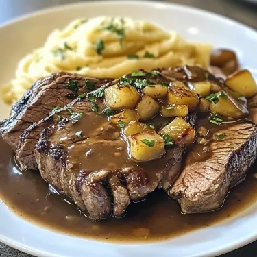 A plate of food with meat and potatoes.