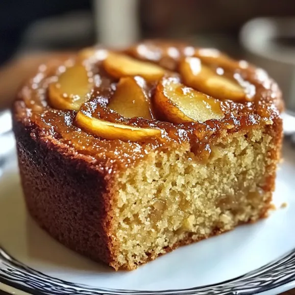 A slice of cake with apples on top.