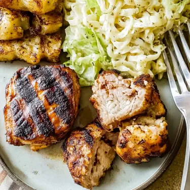 A plate of food with meat and salad.