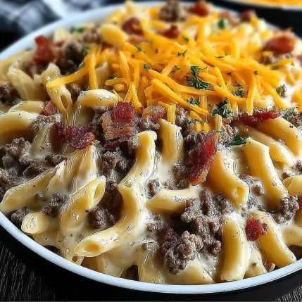 A plate of food with cheese and bacon.