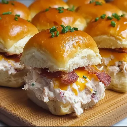A plate of bacon and cheese sandwiches.