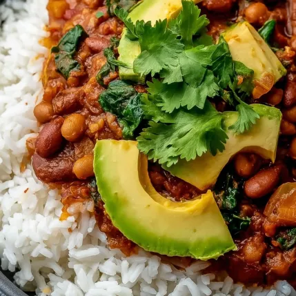 A bowl of food with rice and beans.