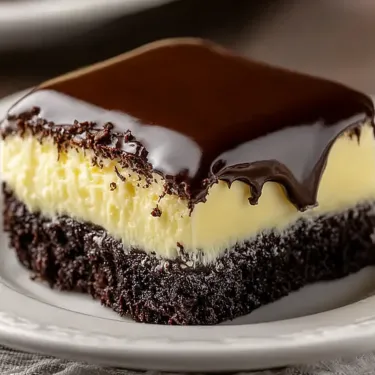 A slice of chocolate cake on a plate.