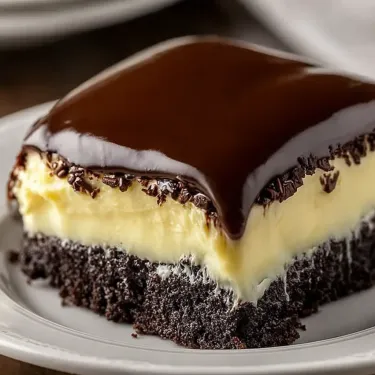 A slice of chocolate cake on a plate.