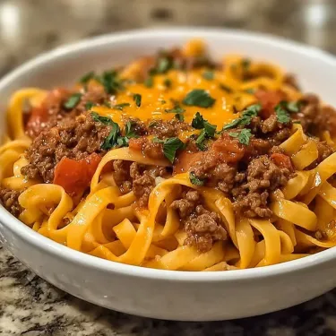 A bowl of spaghetti with meat sauce.
