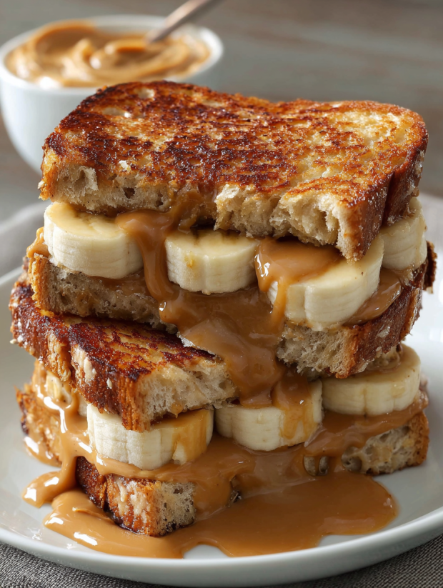 A stack of grilled peanut butter banana sandwiches.