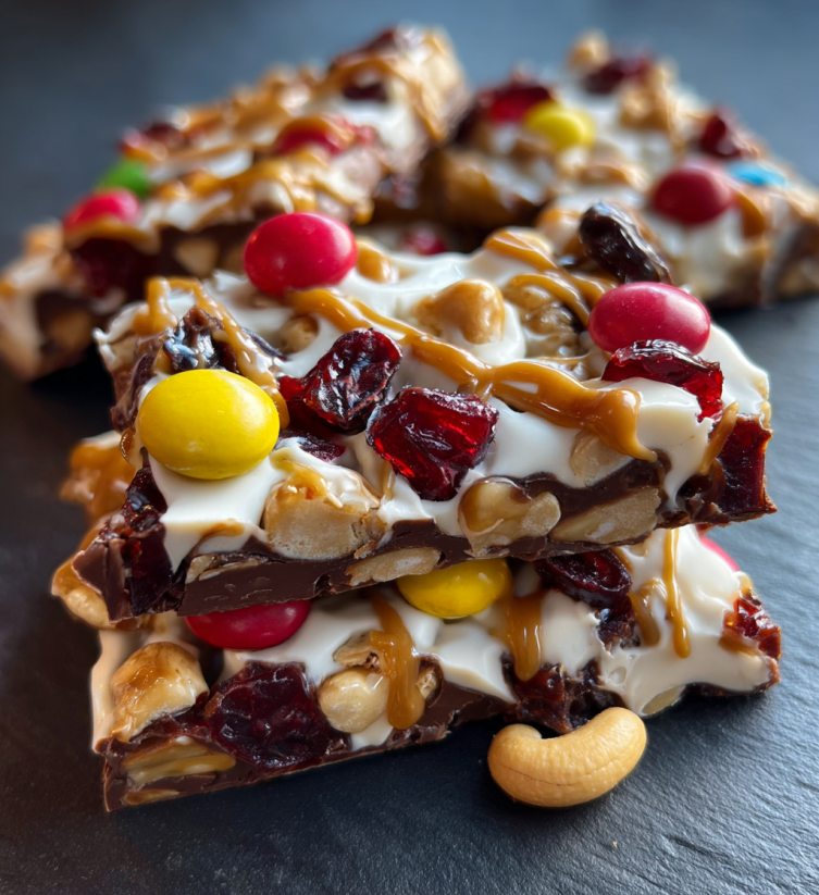A stack of candy bars with a variety of toppings.