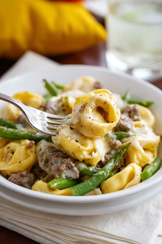 A plate of food with a fork on it.