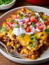 A plate of food with a fork on it.